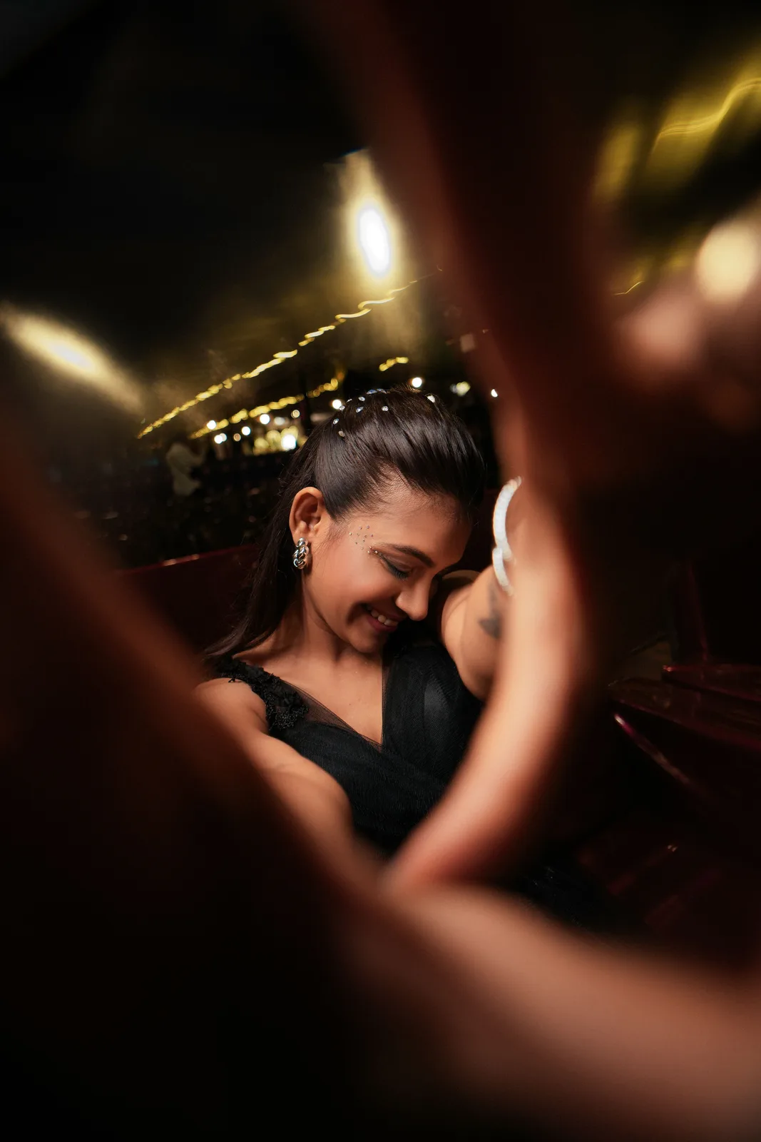 Elegant woman smiling joyfully during a night out (photo: Pexels, https://www.pexels.com/photo/joyful-night-out-with-elegant-woman-37191979/)