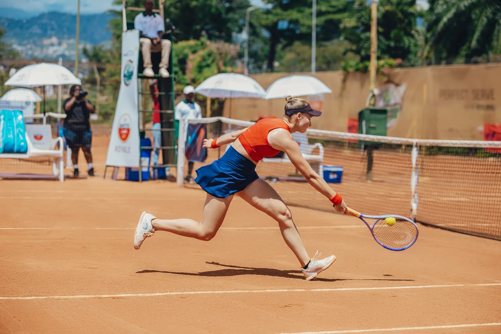 Tennis player lunging for the ball during an outdoor match on a clay court (photo: Pexels, https://www.pexels.com/photo/action-packed-outdoor-tennis-match-on-clay-court-37112809/)
